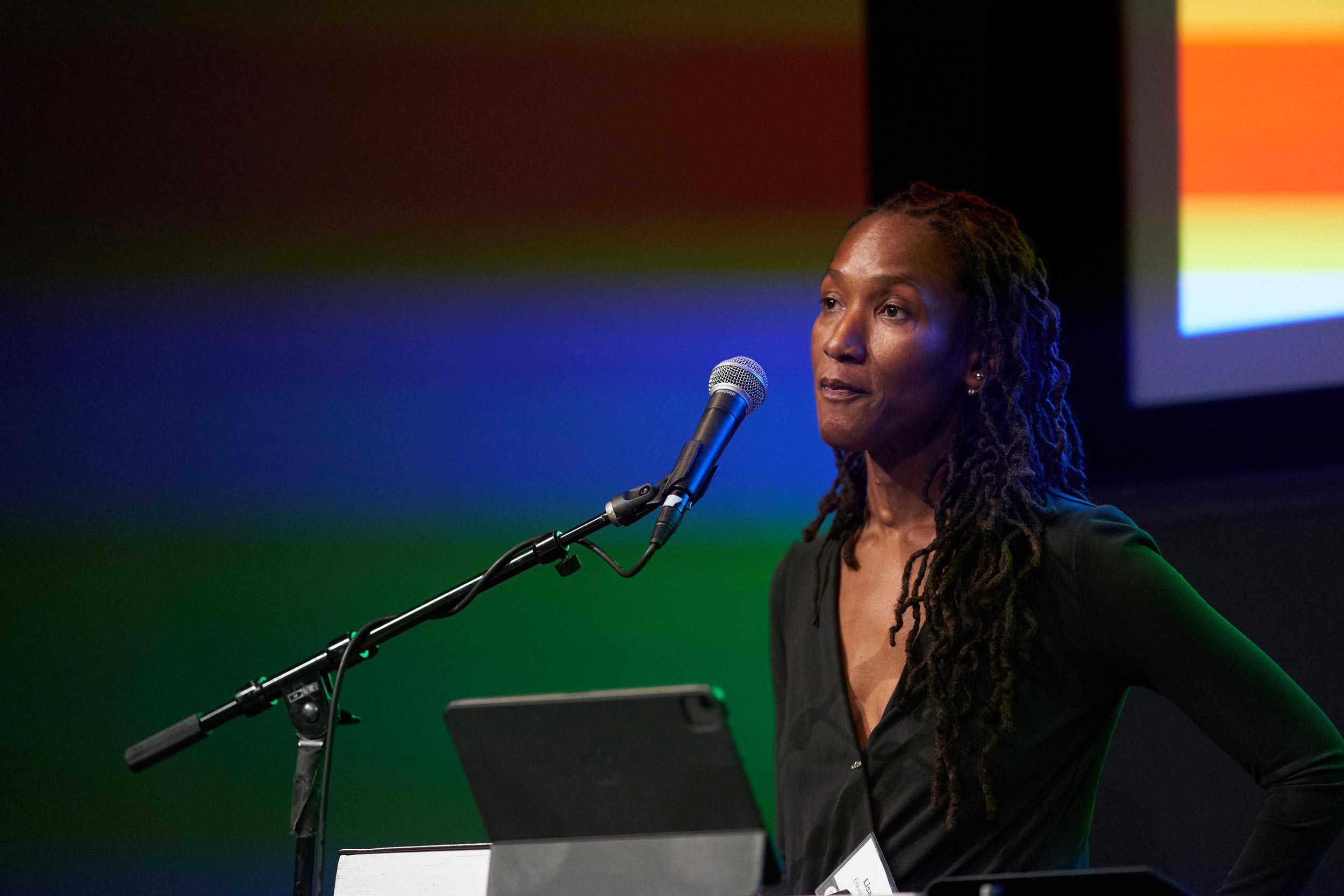 Black woman speaking at podium