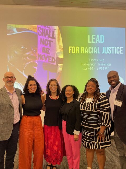 Group in front of Lead For Racial Justice Sign