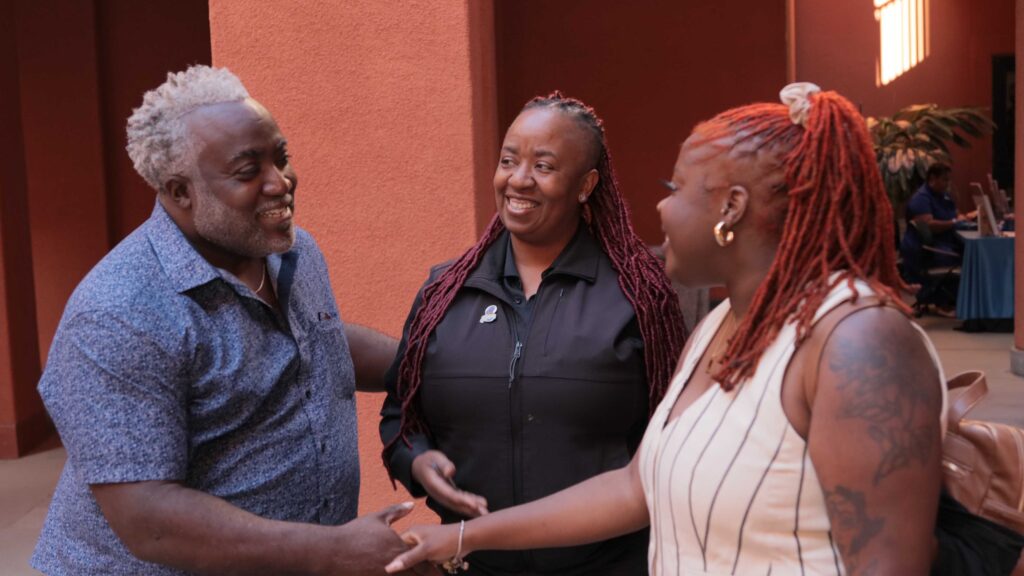 Man and Woman shaking hands at State of Black California Sacramento