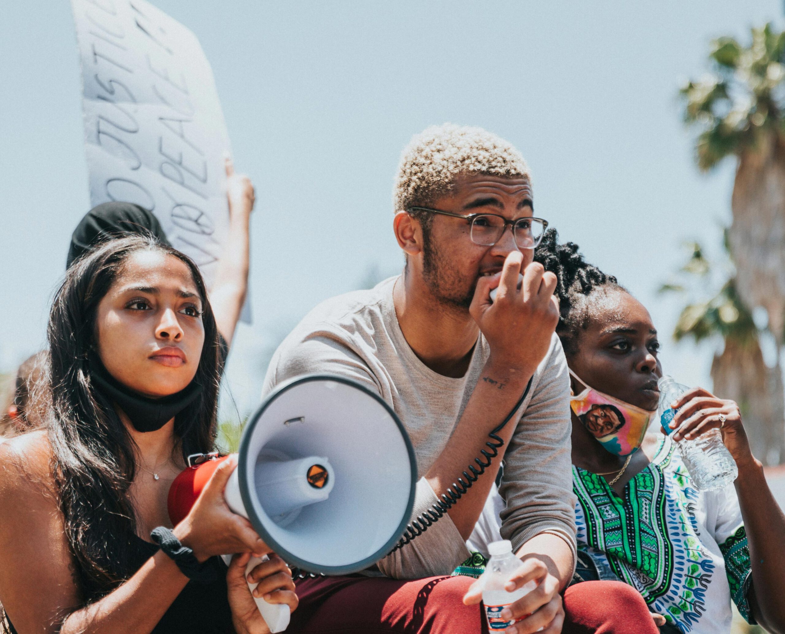black young adults at a rally