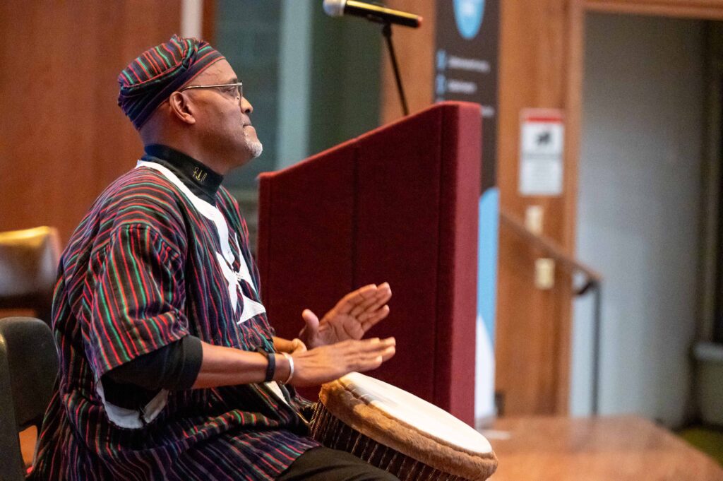 black man playing drum