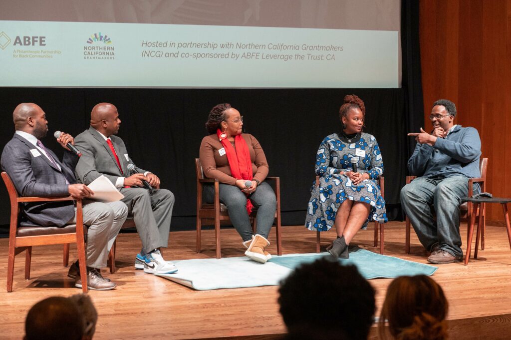 Marc Philpart moderates a panel featuring James Herard, Tamisha Torres-Walker, Kavon Ward and James Woodson on their experiences organizing and building Black communities.