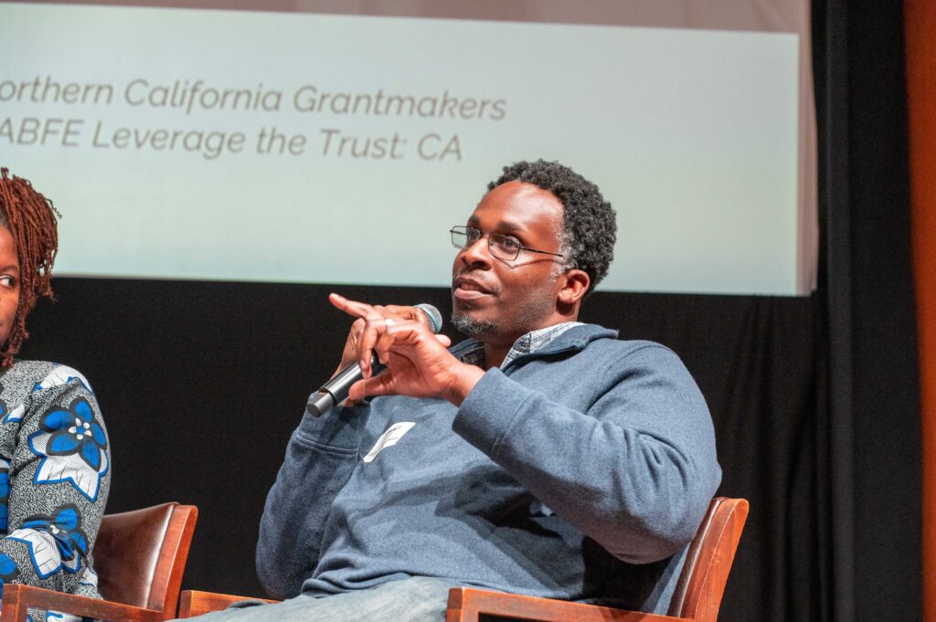 Man speaking on experiences organizing and building Black communities.