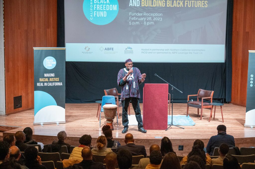 man speaking on stage