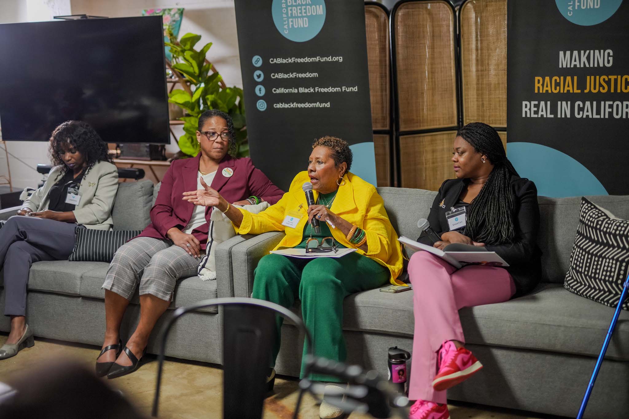 Group on a couch speaking at Fresno Black Pow(Her) Building Event