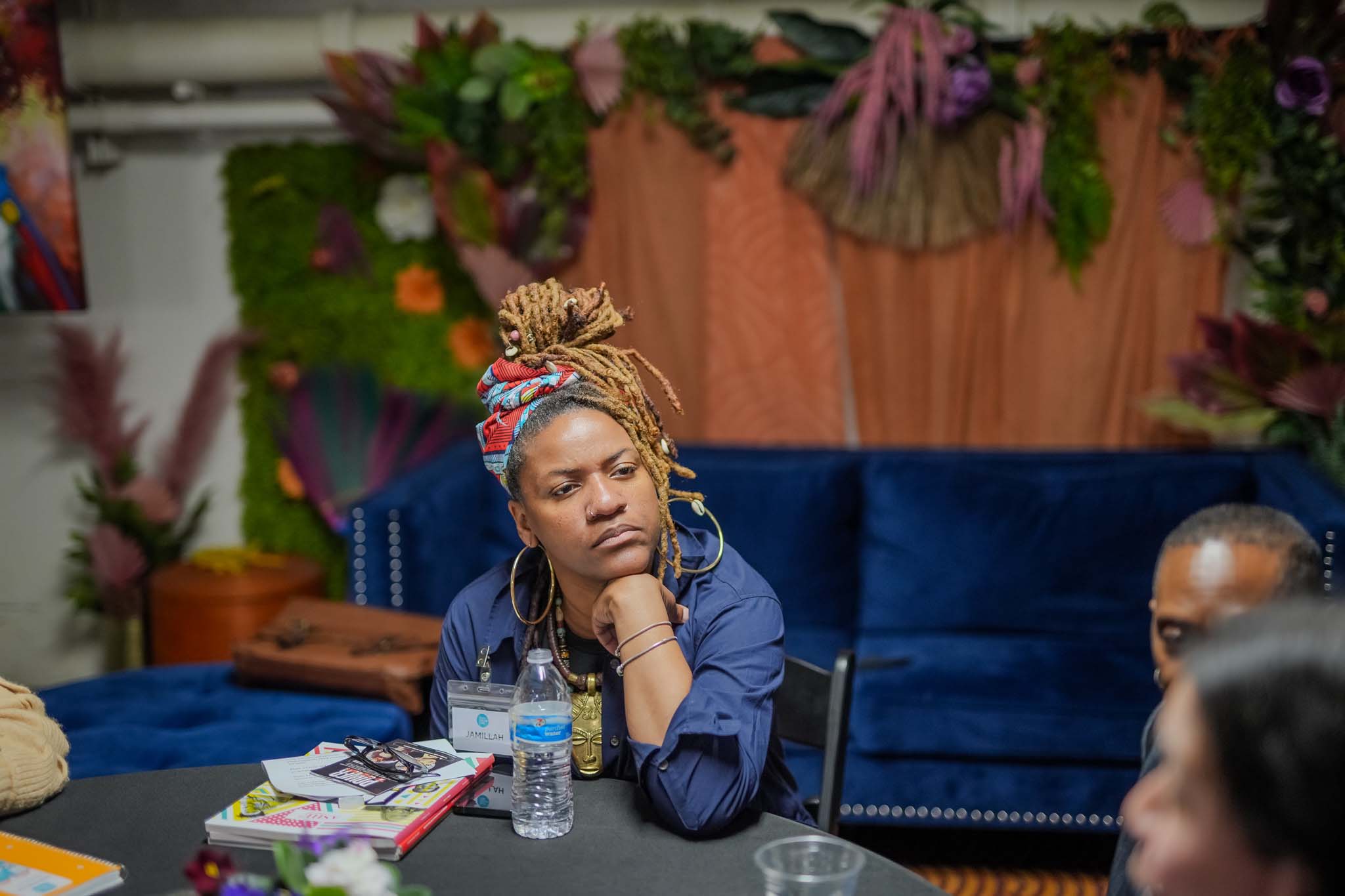 Woman sitting at a table listening