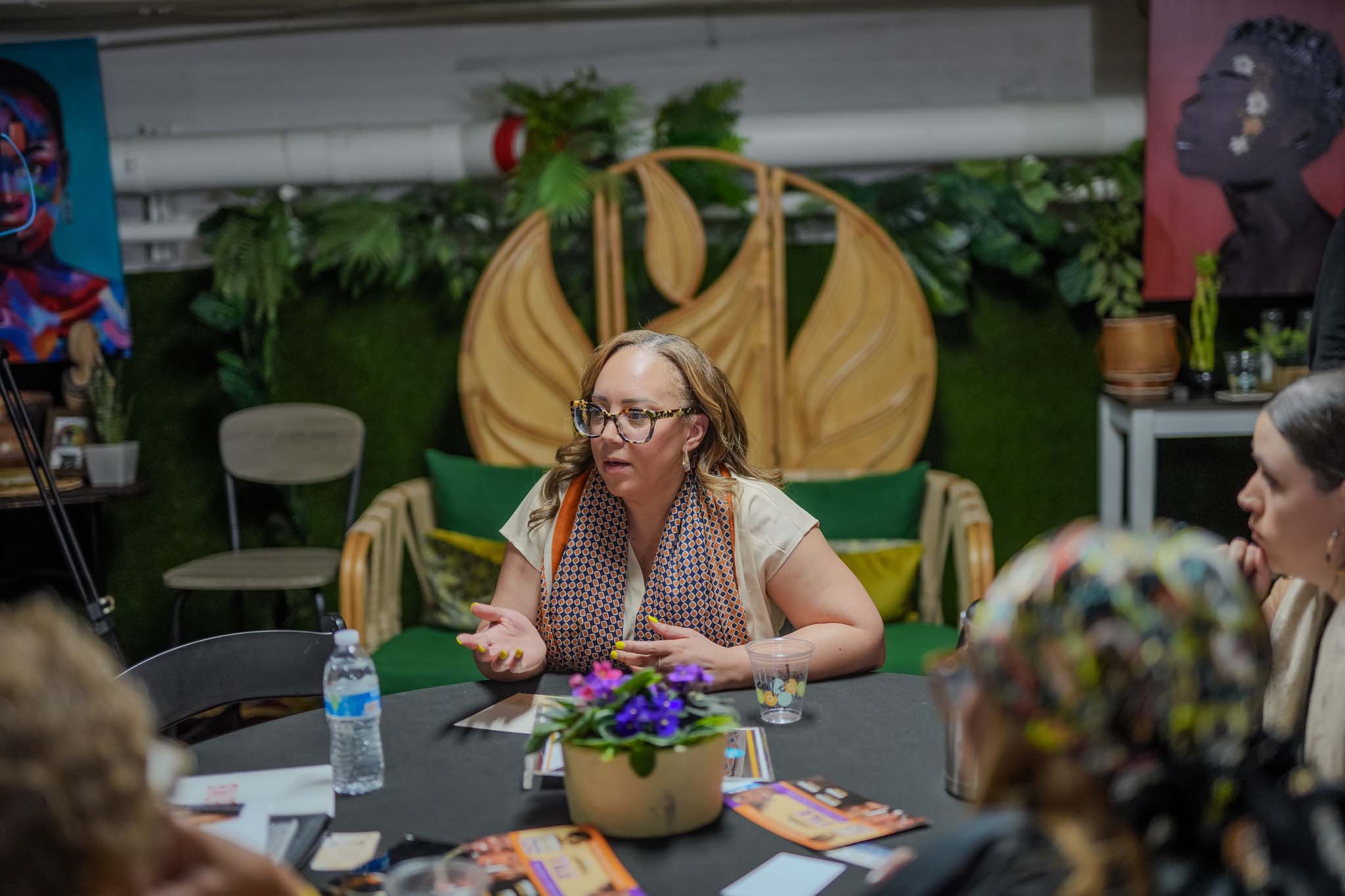 Woman speaking at a table