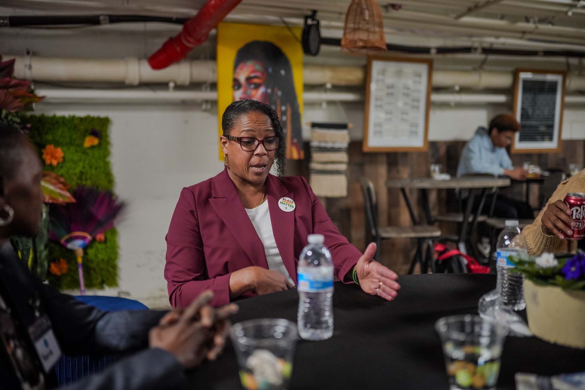 Black woman speaking at Fresno Black Pow(Her) Building Event
