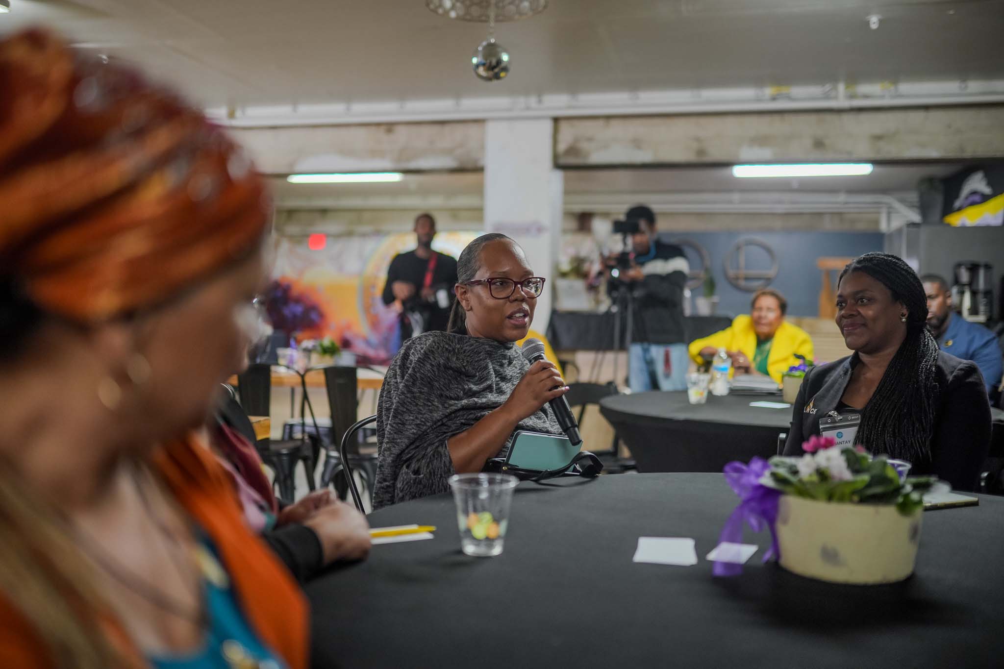 Woman speaking at Fresno Black Pow(Her) Building Event