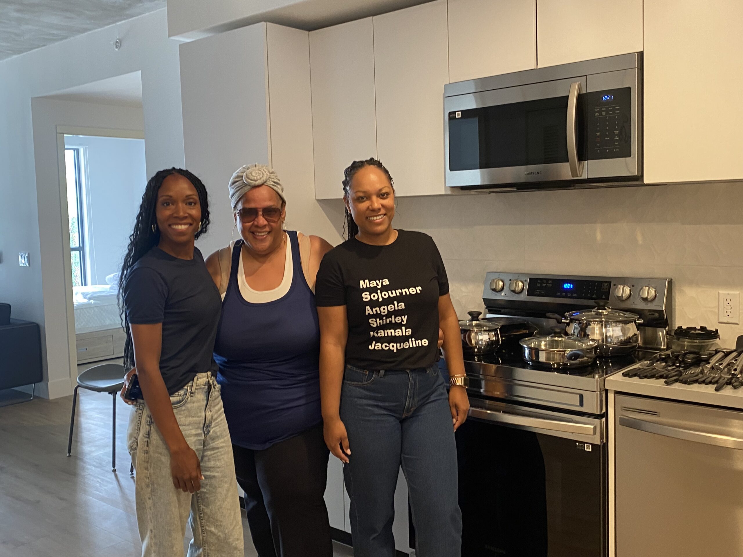 image of three women standing together in a kitchen